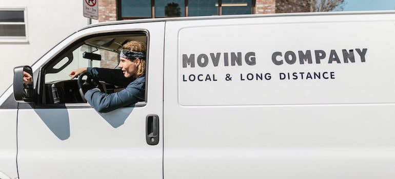 picture of a moving company employee inside of a van